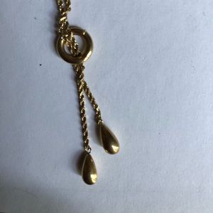Women’s gold necklace.